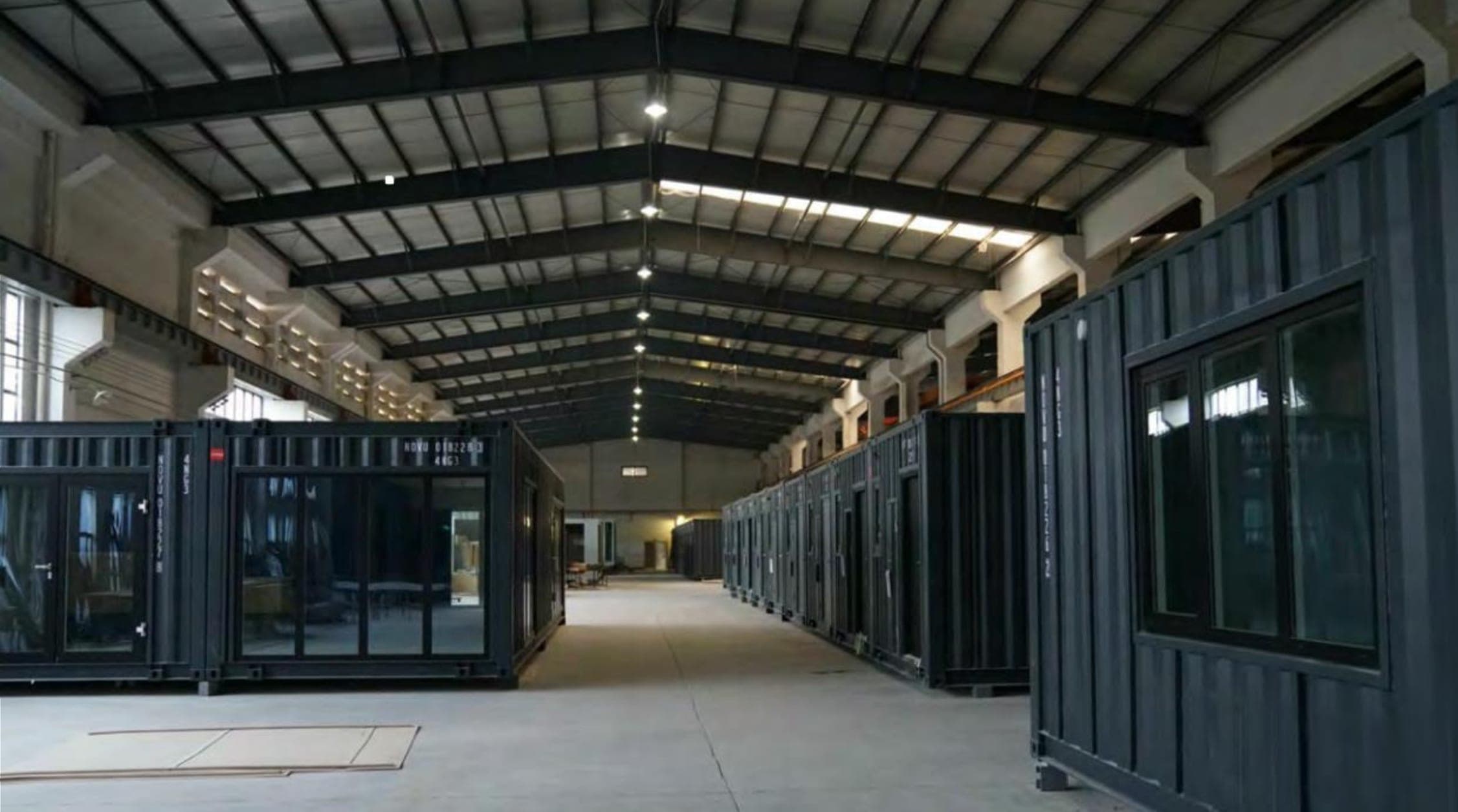Rows of completed 6Homes modules on the factory floor